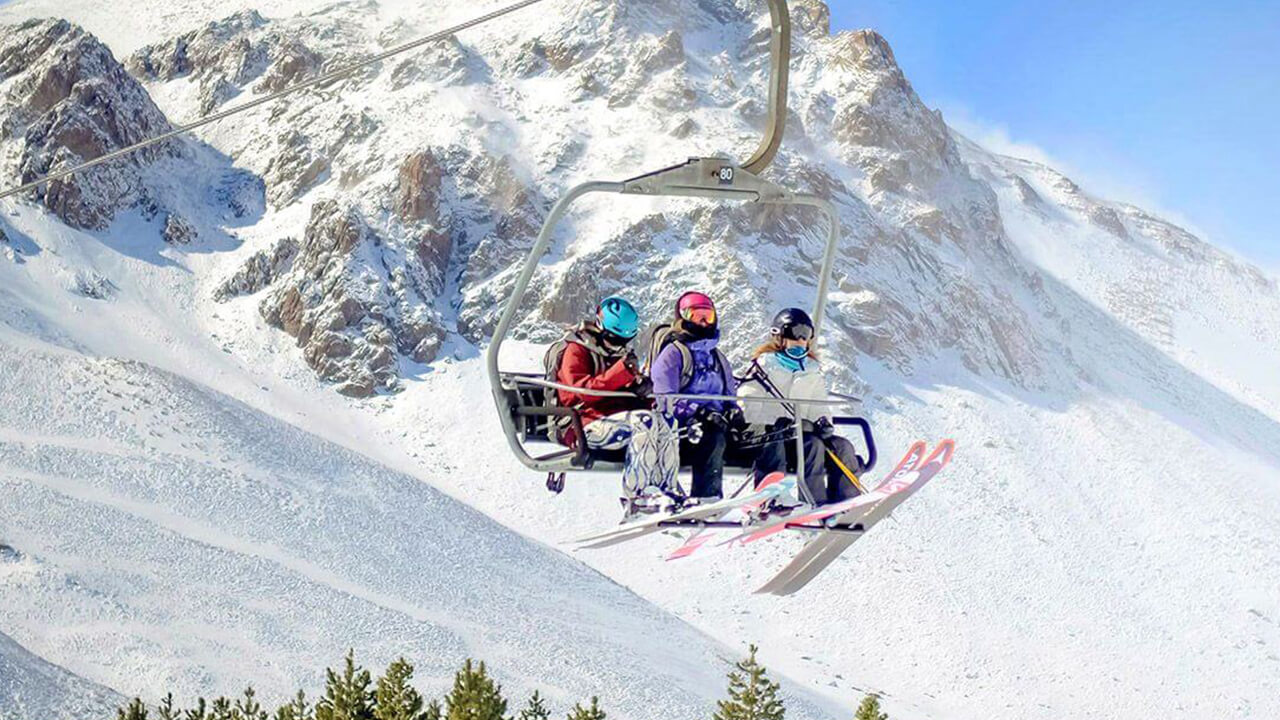 People in Las Leñas chairlift